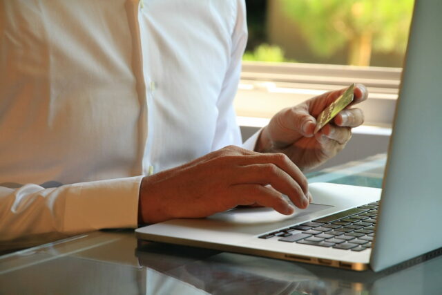A customer using their credit card to make an online purchase